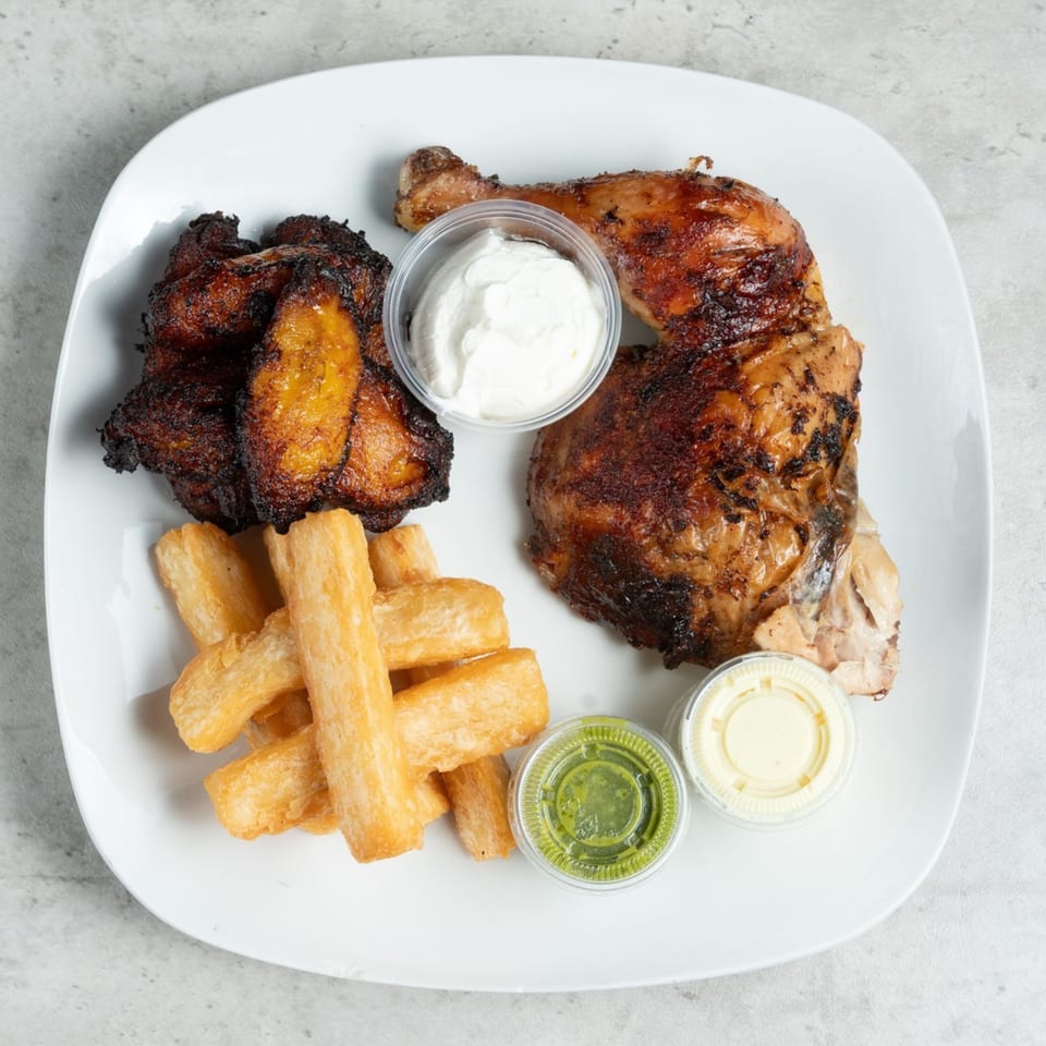 Halal grilled chicken leg and thigh with fried plantains, yucca fries, and three dipping sauces.