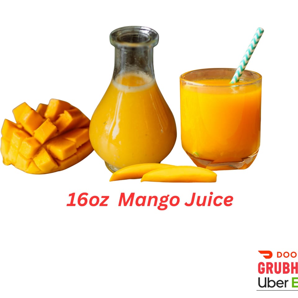A glass and a bottle of mango juice, with mango slices and a striped straw.