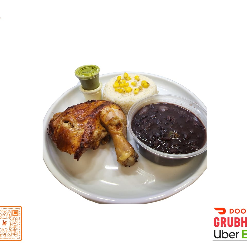 Halal chicken leg and thigh with rice, corn, black beans, and green sauce on a white plate.